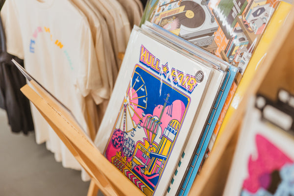 Hull Fair art print in a rack with other Hull themed art prints