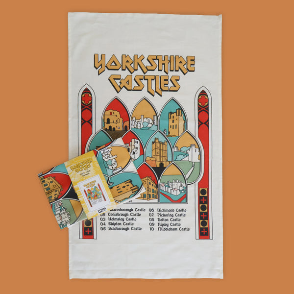 Tea towel with 'Yorkshire Castles' design on a white background