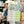 Person holding a stack of 'East Yorkshire' jigsaw puzzle boxes in a store setting.