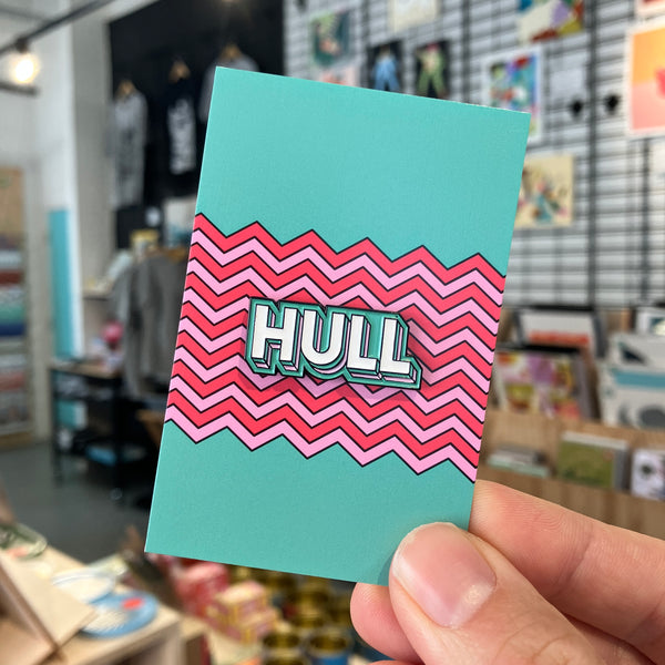 Hull enamel pin badge held in Form Shop & Studio