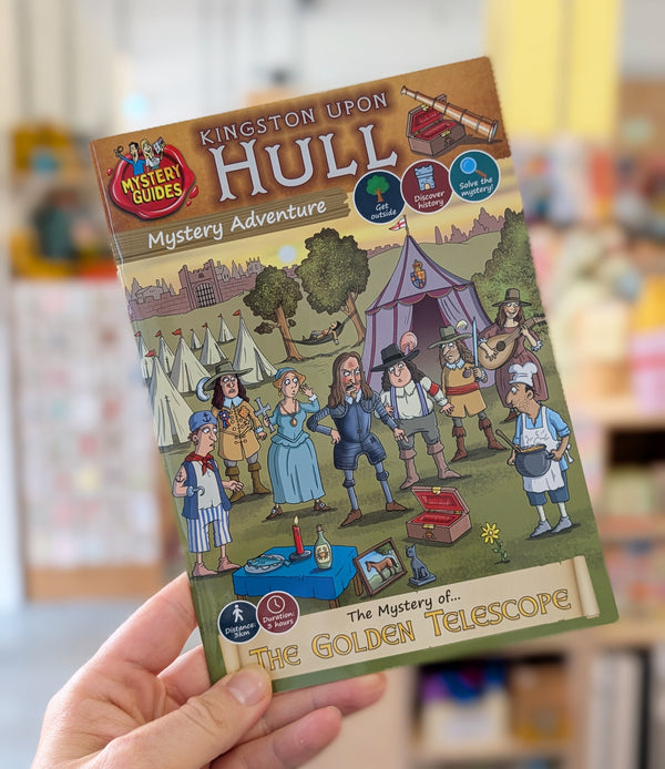 Book titled 'Kingston upon Hull Mystery Adventure' held by a person with a blurred background