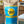 Cuppa Kindness Tea package with teal and yellow 'Rise & Shine' branding on a blurred background