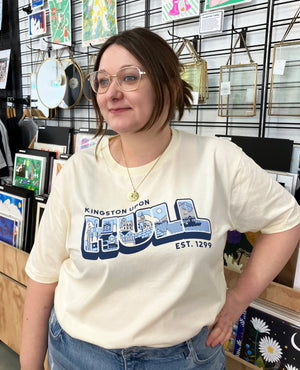 Woman wearing Kingston Upon Hull t-shirt, including The Deep, Spurn Lightship, Humber Bridge, Humber Street and Maritime Museum. Designed by Joseph Cox for Form Shop & Studio
