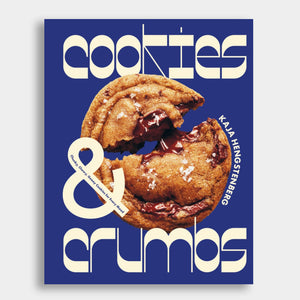 A gooey cookie on the cover of the recipe book Cookies & Crumbs by Kaja Hengstenberg